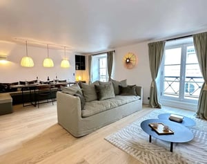 Sofa dining set pendant lights coffee tables living room at Apartment in 7 Rue Corneille, 75006 Paris, France in Paris Student Accommodation