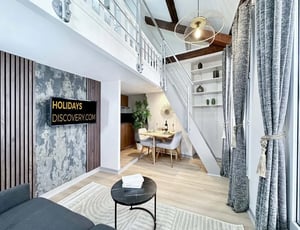 Television on patterned wall dining area staircase interior at Apartment in 14 Rue d'Hautpoul, 75019 Paris, France in Paris Student Accommodation