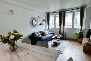 Sofa coffee table rug plant living room at Apartment in Rue d'Anjou, 75008 Paris, France in Paris Student Accommodation
