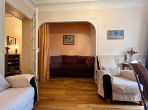 Two sofas armchairs and wooden floor living room at Apartment in 39 Av. Félix Faure, 75015 Paris, France in Paris Student Accommodation