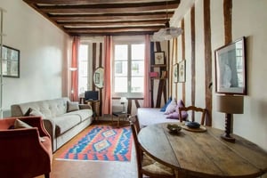 Sofa daybed table rug lamp living room at Studio in 12 Rue de l'Hôtel Colbert, 75005 Paris, France in Paris Student Accommodation