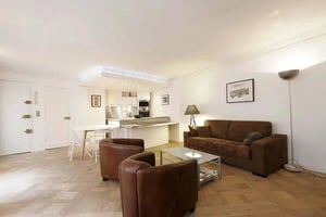 Sofa chairs table kitchen cabinets lighting living room at Apartment in 15 Rue Gaillon, 75002 Paris, France in Paris Student Accommodation