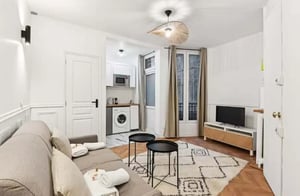 Sofa kitchen unit washer TV living room at Studio in 115 Rue de Tocqueville, 75017 Paris, France in Paris Student Accommodation