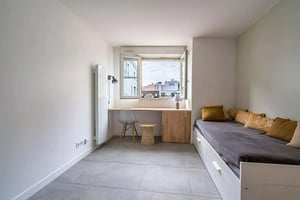 Bed desk chair radiator pillows bedroom at Studio in Rue du Buisson Saint-Louis, 75010 Paris, France in Paris Student Accommodation
