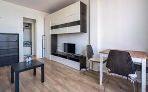 Black coffee table television and dining set Living room at Studio in Rue Didot, 75014 Paris, France in Paris Student Accommodation