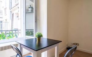 Table with plant and chairs dining area at Studio in Rue de Capri, 75012 Paris, France in Paris Student Accommodation