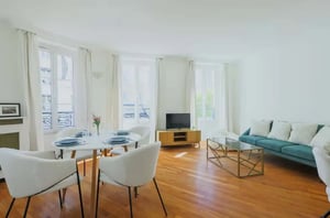 Dining table with chairs couch and coffee table living room at Apartment in 90 Rue Cambronne, 75015 Paris, France in Paris Student Accommodation