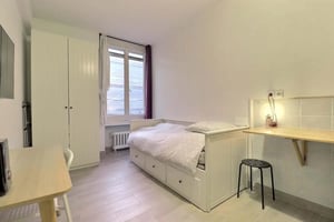 Bed desk wardrobe radiator window study area bedroom at Studio in Rue du Cardinal Lemoine, 75005 Paris, France in Paris Student Accommodation