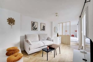 Sofa artworks glass divider bed living room at Studio in 12 Rue des Écouffes, 75004 Paris, France in Paris Student Accommodation