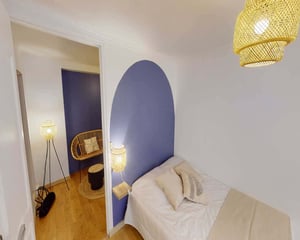 Bed with pillows and bamboo lamps bedroom at Room in 9 Rue Bergère, 75009 Paris, France in Paris Student Accommodation