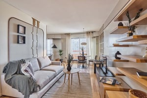 Sofa coffee table dining area and shelves living room at Apartment in 17 Av. d'Italie, 75013 Paris, France in Paris Student Accommodation