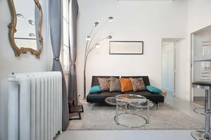 Sofa coffee table floor lamp rug living room at Apartment in 6 Rue de Montmorency, 75003 Paris, Francia in Paris Student Accommodation