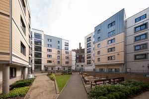 Modern buildings with outdoor seating area exterior at Albert Court in Liverpool Student Accommodation