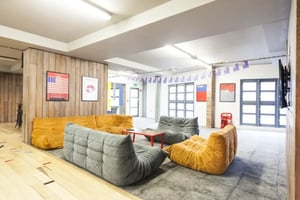 Sectional sofas with beanbag chairs common area at Mcmillan student Village in Greenwich Student Accommodation