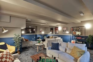 Sofas artwork foosball table living room at Francis Gardner in London Student Accommodation