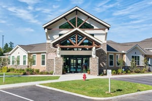 Clubhouse entrance with stone pillars and windows exterior at Waypoint at Hammond in Hammond Student Accommodation