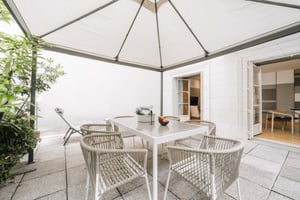 Table chairs lounge chair and plants exterior at Apartment in 31 Rue des Bourdonnais, 75001 Paris, France in Paris Student Accommodation
