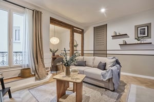 Sofa with pillows rug and coffee table living room at Apartment in 13 Rue de Laborde, 75008 Paris, France in Paris Student Accommodation