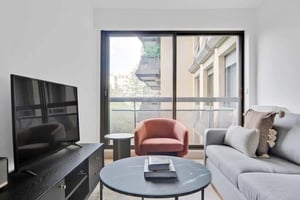 Sofa television and coffee table living room at Apartment in 21 Rue François Gérard, 75016 Paris, France in Paris Student Accommodation