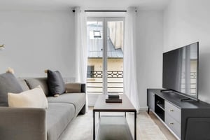 Sofa coffee table and TV living room at Apartment in 6 Rue de l'Echaudé, 75006 Paris, France in Paris Student Accommodation