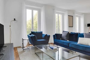 Blue sofa armchair coffee table living room at Apartment in 40 Rue Fabert, 75007 Paris, France in Paris Student Accommodation