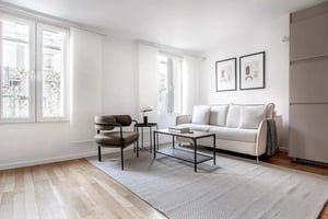 Sofa chair coffee table framed art living room at Apartment in 12 Rue des Moulins, 75001 Paris, France in Paris Student Accommodation