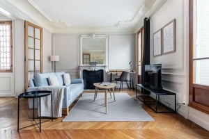 Sofa fireplace desk and television living room at Apartment in 47 Rue de Boulainvilliers, 75016 Paris, France in Paris Student Accommodation