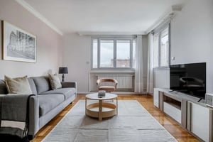 Grey sofa coffee table and TV living room at Apartment in 78 Av. Félix Faure, 75015 Paris, France in Paris Student Accommodation