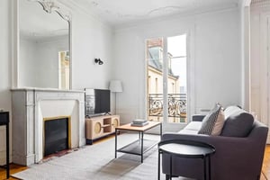 Sofa coffee table television fireplace living room at Apartment in 37 Rue Davioud, 75016 Paris, France in Paris Student Accommodation