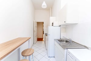 Kitchen with breakfast bar fridge microwave and sink kitchen at Studio in Immanuelkirchstraße 17, 10405 Berlin, Germania in Berlin Student Accommodation