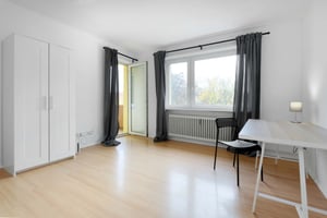 White wardrobe desk chair lamp and open door study area at Room in Liebenwalder Str., 13347 Berlin-Mitte, Germany in Berlin Student Accommodation