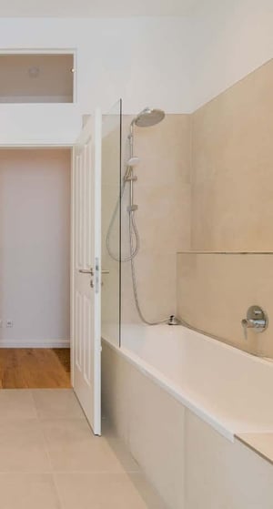 Bathtub shower with glass screen and open door bathroom at Apartment in Torstraße 225, 10115 Berlin, Germany in Berlin Student Accommodation