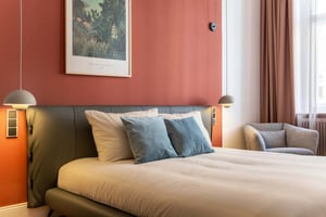 Bed with pillows art and chair bedroom at Studio in Wielandstraße, 10707 Berlin-Bezirk Charlottenburg-Wilmersdorf, Germany in Berlin Student Accommodation