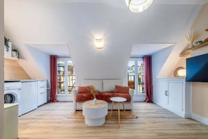 Sofa washing machine cabinets and coffee tables living room at Studio in 22 Rue d'Édimbourg, 75008 Paris, France in Paris Student Accommodation