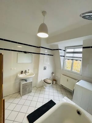 Sink toilet bathtub radiator washing machine bathroom at Apartment in Radickestraße, Berlin with 1 bedroom in Berlin Student Accommodation