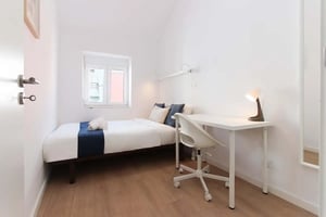 Bed desk lamp and chair bedroom at Great apartment in Alameda, Lisbon in Lisbon Student Accommodation