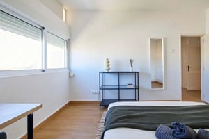 Bed with shelves mirror and window bedroom at Luminous bedroom in a 6-room apartment in Areeiro, Lisbon - Room 1 in Lisbon Student Accommodation