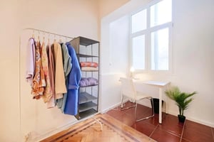 Clothes rack desk and chair study area at Bedroom in a 3-bedroom apartment in Lisbon - Room 1 in Lisbon Student Accommodation