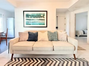 Sofa artwork and rug living room at Apartment in Rua Cidade de Quelimane, Lisboa in Lisbon Student Accommodation