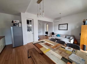 Refrigerator dining table sofa living room at Family apartment with 125 m² and 3 bedrooms in Lisbon City Centre in Lisbon Student Accommodation