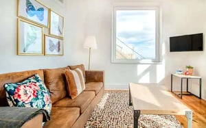 Sofa butterfly art lamp coffee table living room at Rua Rui Barbosa in Lisbon Student Accommodation