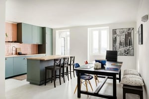 Kitchen with island table and chairs living room at Graça's Charming Living in Lisbon Student Accommodation