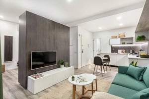 Living area with tv sofa and kitchen Living room at Travessa do Oleiro in Lisbon Student Accommodation