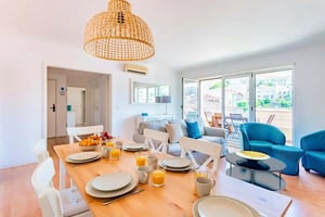 Table setting with food sofa and chairs living room at Avenida da Liberdade in Lisbon Student Accommodation