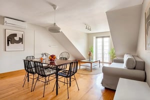 Dining table chairs couch coffee table living room at Arriaga River Views I in Lisbon Student Accommodation