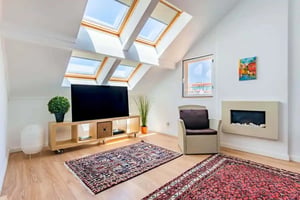 TV stand chair rugs fireplace living room at Costa do Castelo Skyviews in Lisbon Student Accommodation