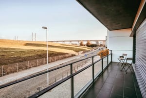 Balcony with chairs and city view exterior at Bridge View with Balcony in Lisbon Student Accommodation