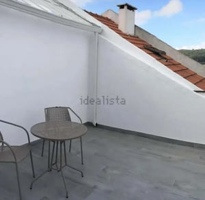 Table and chairs on patio exterior at 2BDR Duplex with terrace in Lisbon in Lisbon Student Accommodation