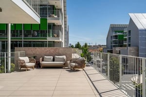 Wicker chairs and sofa on a balcony exterior at Apartment in Rua A ao Braço de Prata, Lisboa for 163 m² with 3 bedrooms in Lisbon Student Accommodation
