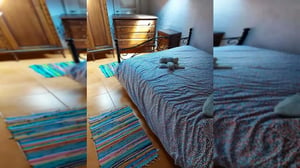 Bed dresser wardrobe colorful rugs bedroom at Rua Emília das Neves in Lisbon Student Accommodation
